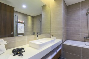 Standard Studio | Bathroom | Separate bathtub and shower, deep-soaking bathtub, rainfall showerhead - Aurora Serviced Apartments - Adults Only (Ho Chi Minh City)