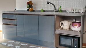 Coffee/tea maker, full-size fridge, microwave (on request), stovetop