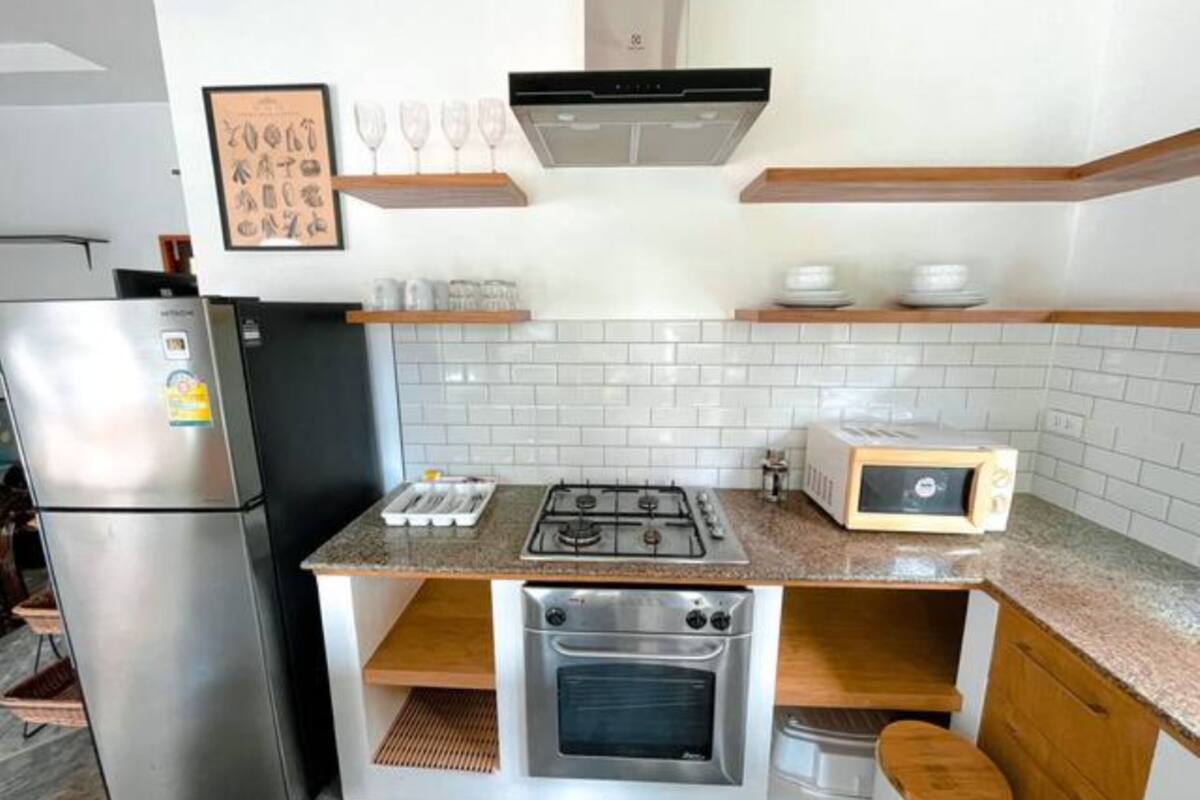 villa, 2 bedrooms, poolside | private kitchen | full-sized fridge, microwave, stovetop, coffee/tea maker