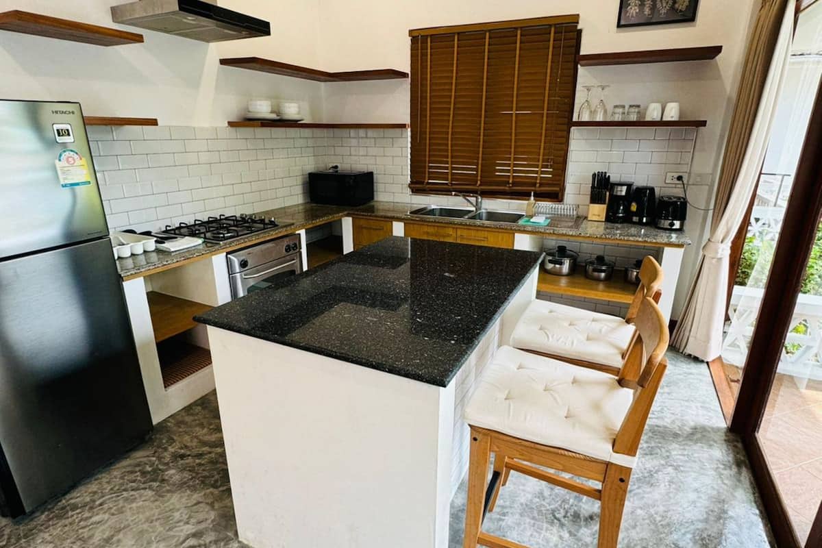 villa, 2 bedrooms, poolside | private kitchen | full-sized fridge, microwave, stovetop, coffee/tea maker