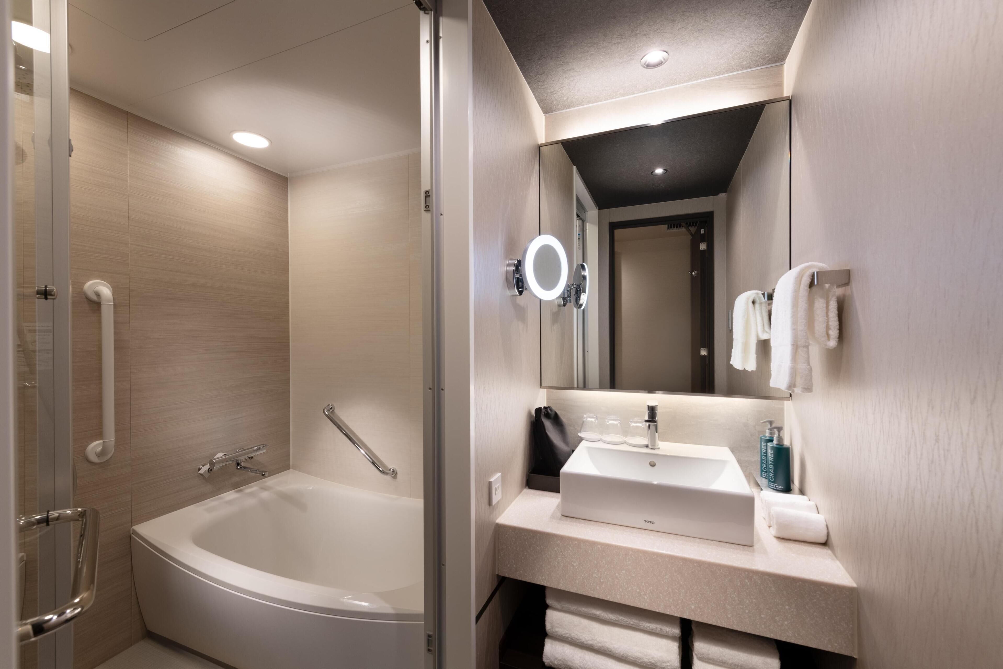 premium room, 3 single beds | bathroom | combined shower/bathtub, deep-soaking bathtub, free toiletries