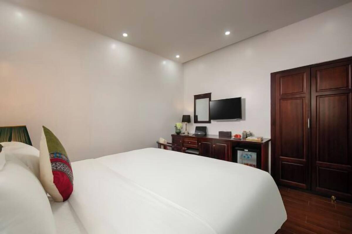 Luxe beddengoed, een minibar, een kluis op de kamer, een bureau