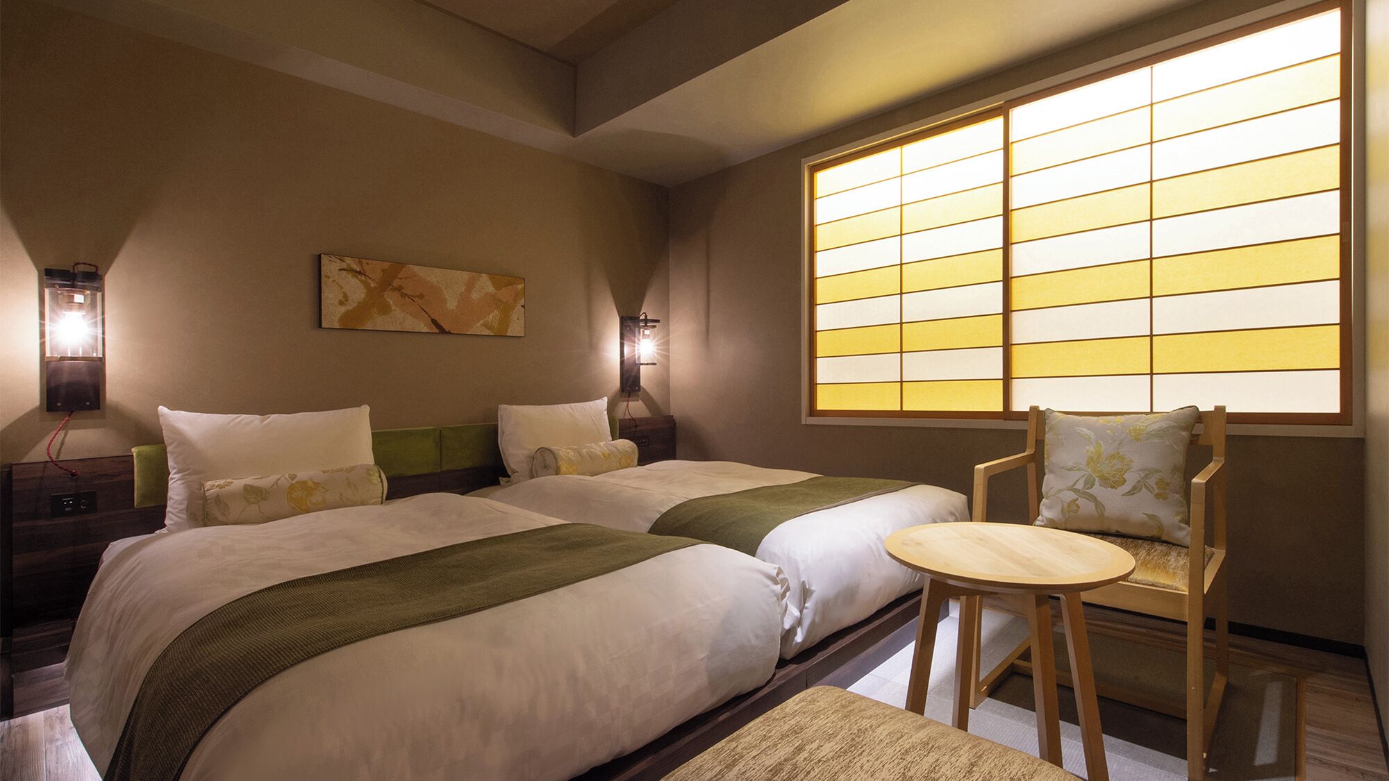 A hotel room with two beds, a chair, and a large window with a view.