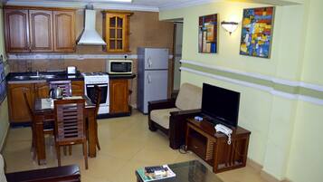 Family Apartment, 3 Bedrooms | Private kitchen | Fridge, microwave, coffee/tea maker