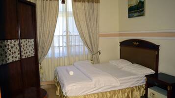 Apartment, 1 Bedroom | 1 bedroom, in-room safe, desk, iron/ironing board