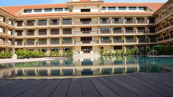 Outdoor pool, open 6 AM to 10 PM, pool umbrellas, pool loungers