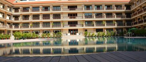 Outdoor pool, open 6 AM to 10 PM, pool umbrellas, pool loungers