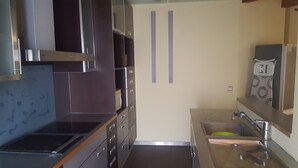 Comfort Apartment, 2 Bedrooms, Mezzanine | Private kitchen | Coffee/tea maker, fridge, microwave, stovetop