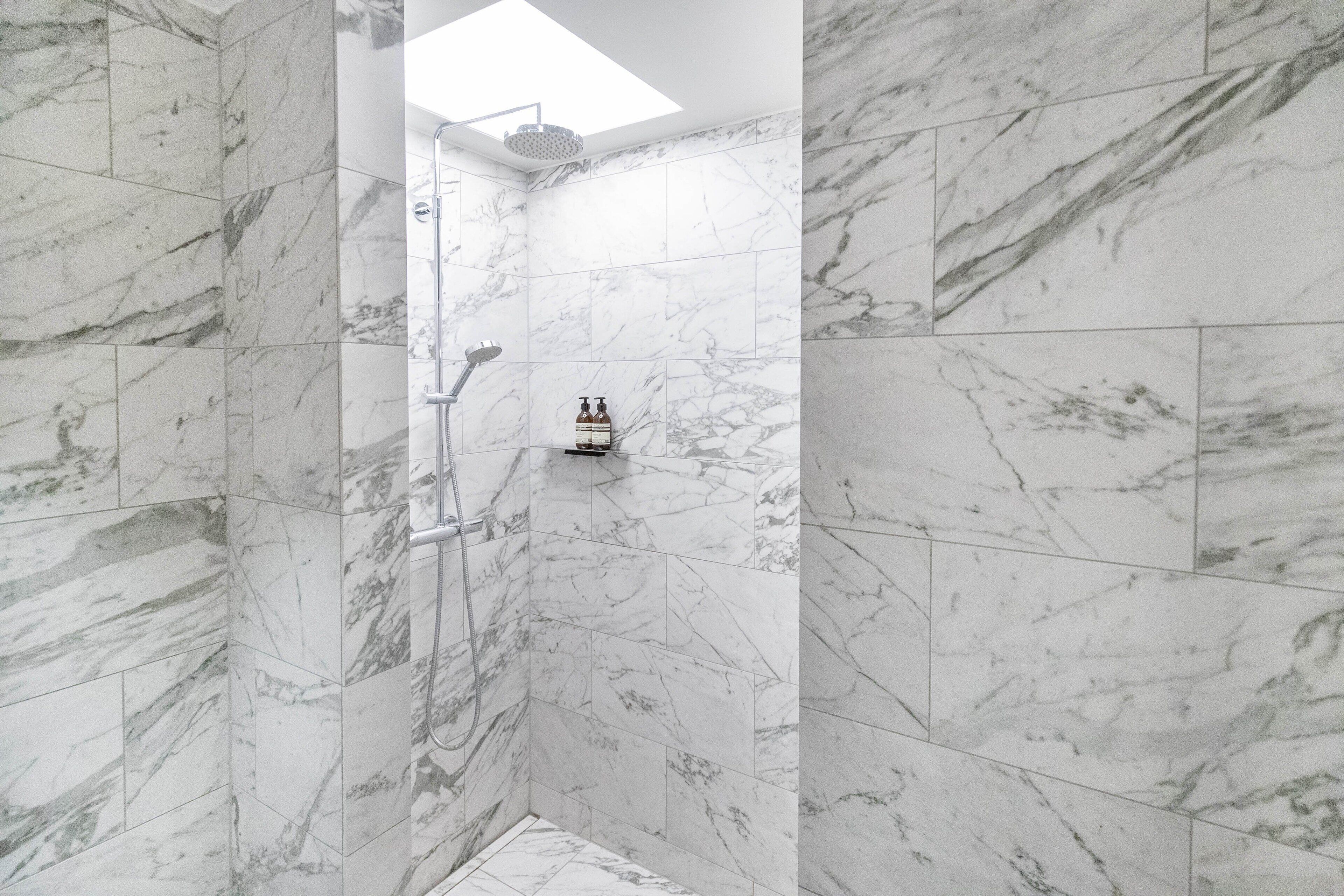 shower, hydromassage showerhead, designer toiletries, hair dryer