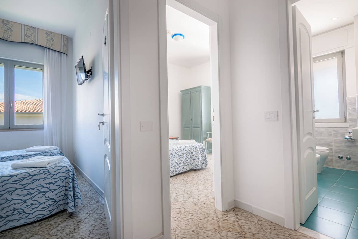 Superior Quadruple Room | Minibar, in-room safe, individually furnished, desk