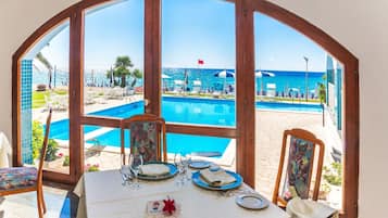 Breakfast, lunch, dinner served; local cuisine, pool views