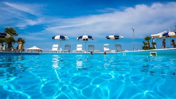 Seasonal outdoor pool, pool umbrellas, pool loungers