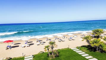 Private beach, white sand, sun loungers, beach umbrellas