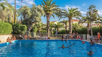 Seasonal outdoor pool, pool umbrellas, pool loungers