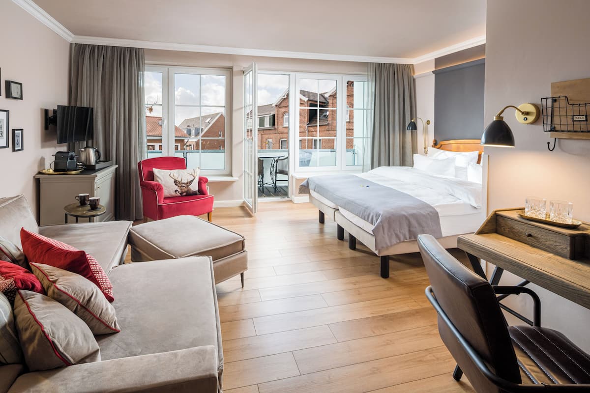 Deluxe-Doppelzimmer, Balkon | Wohnbereich