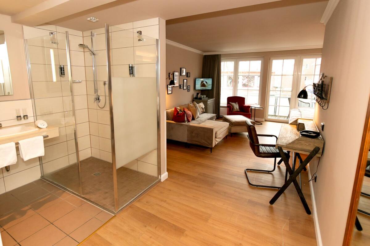 deluxe double room, balcony | bathroom | shower, eco-friendly toiletries, hair dryer, bathrobes