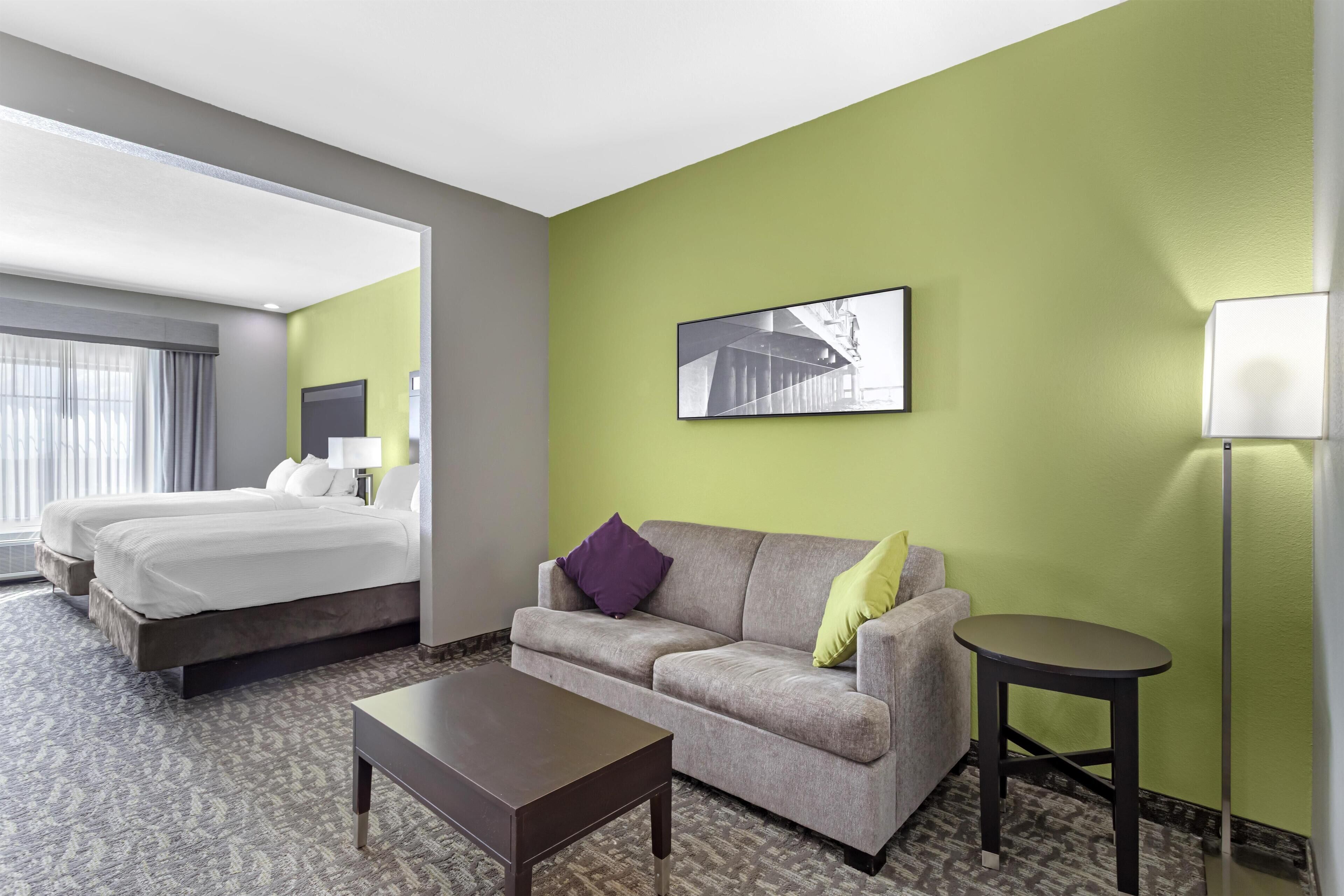 Suite, 2 Queen Beds, Accessible, Refrigerator & Microwave (with Single Sofabed) | Desk, laptop workspace, iron/ironing board, WiFi