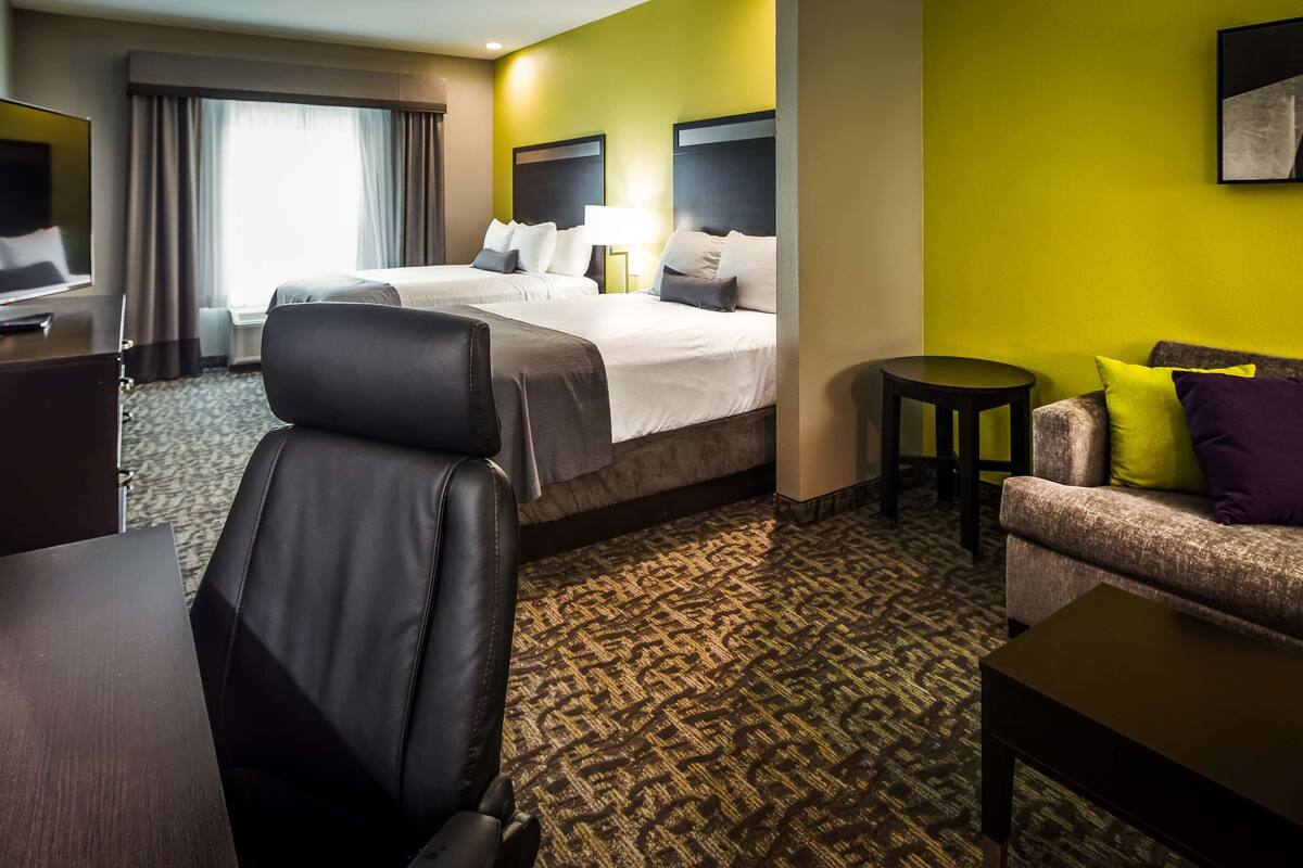 suite, 2 queen beds, non smoking, refrigerator & microwave (with single sofabed) | desk, laptop workspace, iron/ironing board, wifi