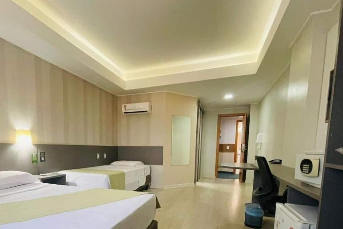 Deluxe Triple Room, 1 Bedroom | 1 bedroom, minibar, in-room safe, desk