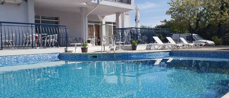 Outdoor pool, pool umbrellas, pool loungers