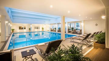 Indoor pool, open 8:00 AM to 8:00 PM, pool loungers