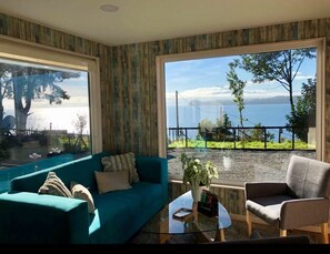 Family Apartment, 2 Bedrooms, Lake View | Living area | Flat-screen TV - Aparthotel Kintumay (Puerto Varas)