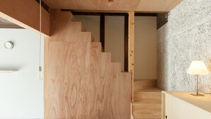 A staircase with wooden steps leading to a higher floor. - Sumidanagaya - Hostel (Tokyo)