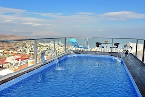 Outdoor pool, pool umbrellas, pool loungers