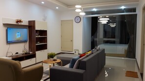 Family Apartment, 3 Bedrooms | Living room | 43-inch LCD TV with cable channels, TV - The Grand Condotel (Ho Chi Minh City)