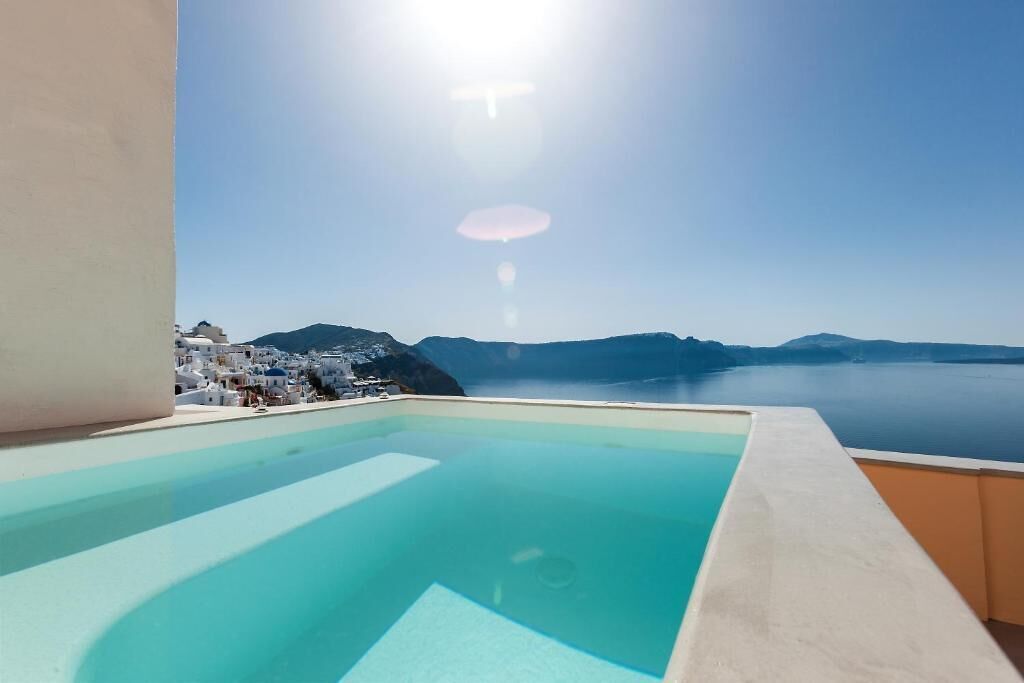 A clear view of a swimming pool with a mountain backdrop.