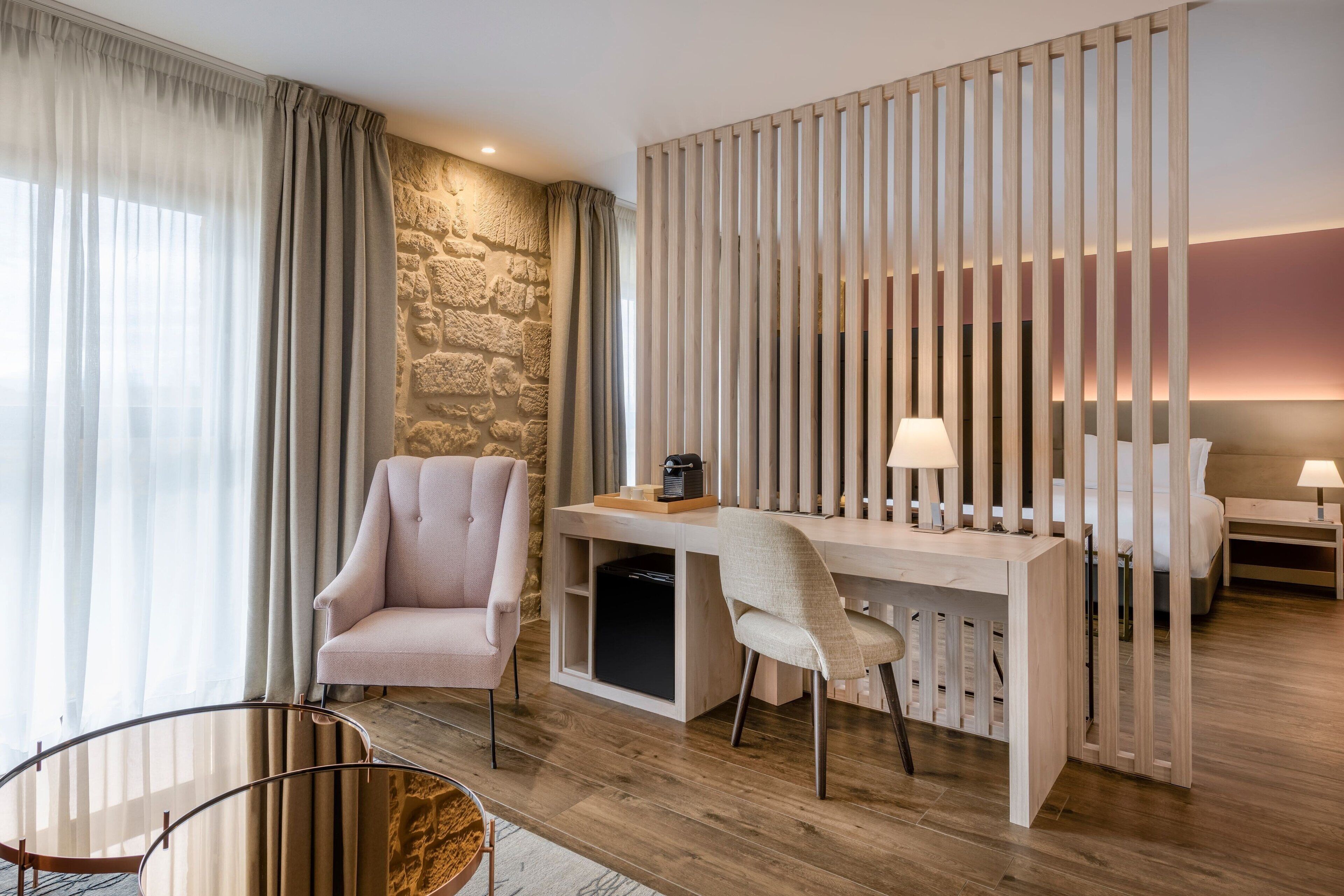 junior suite, 1 king bed, river view | 1 bedroom, minibar, in-room safe, desk