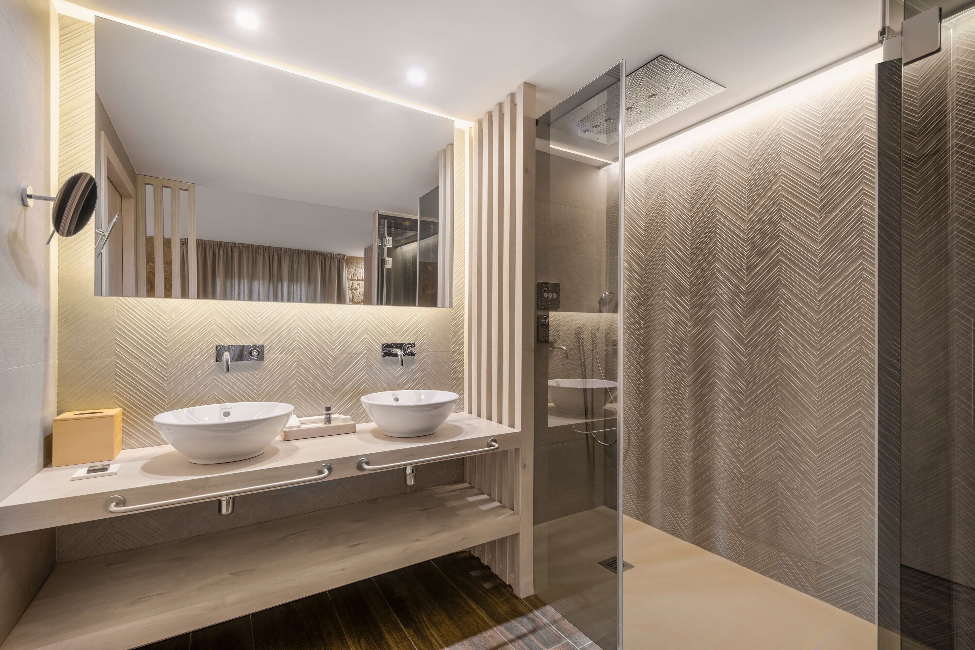 junior suite, 1 king bed, river view | bathroom | shower, rainfall showerhead, designer toiletries, hair dryer