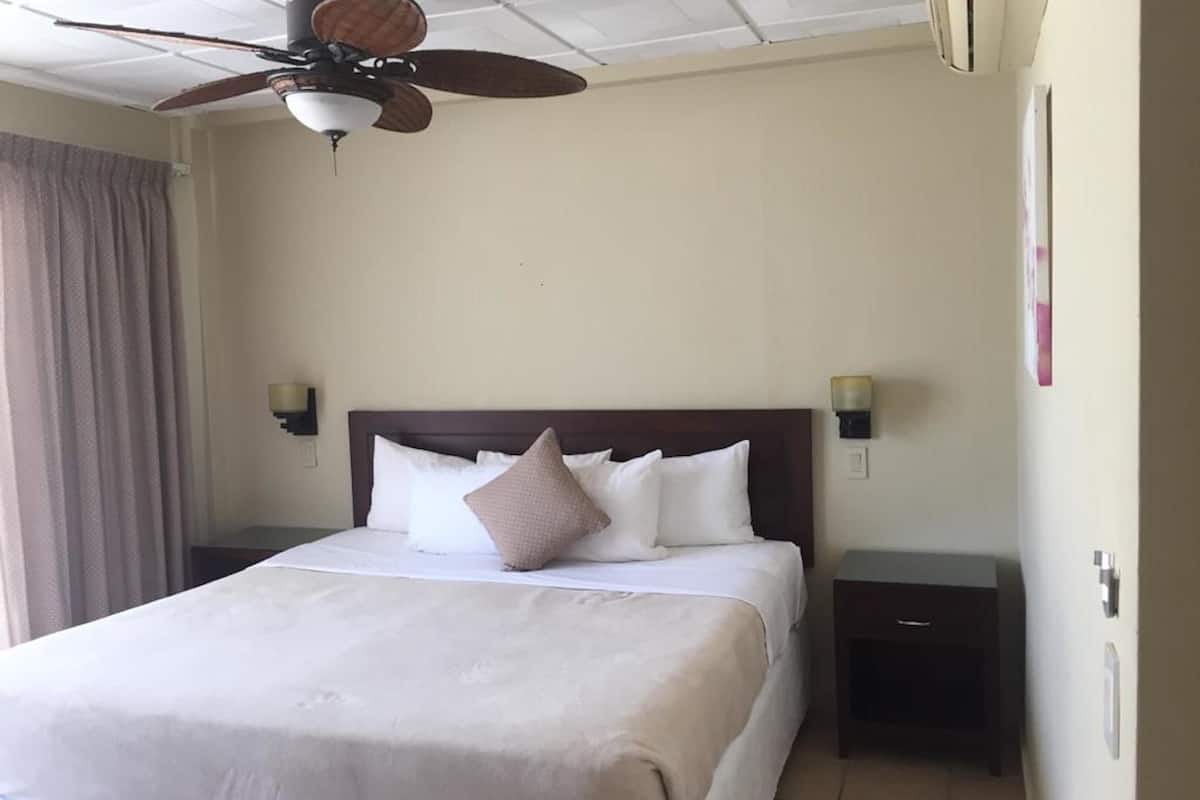 room, 1 king bed | in-room safe, iron/ironing board, free cots/infant beds, bed sheets