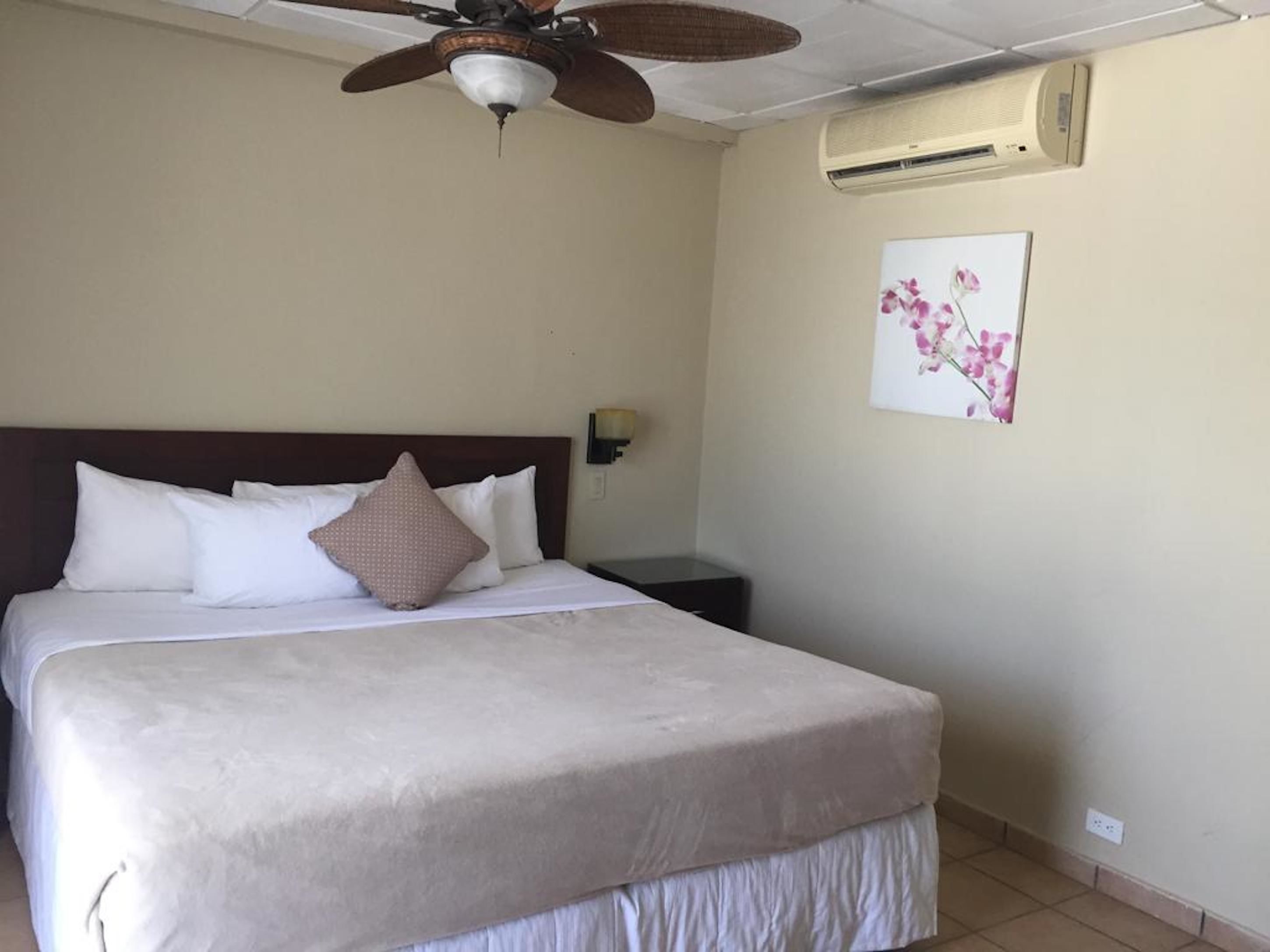 room, 1 king bed | in-room safe, iron/ironing board, free cots/infant beds, bed sheets