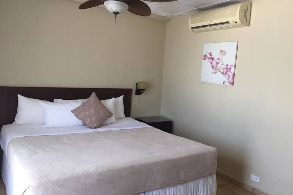 room, 1 king bed | in-room safe, iron/ironing board, free cots/infant beds, bed sheets