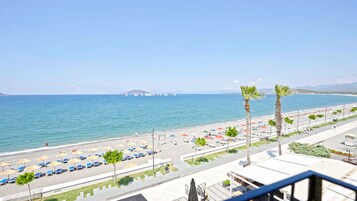 On the beach, sun-loungers, beach umbrellas