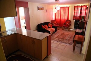 Double Room | Living area | 50-cm TV with cable channels