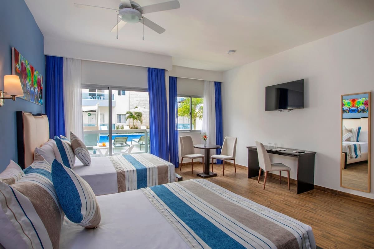 studio with pool view | in-room safe, desk, soundproofing, free cots/infant beds