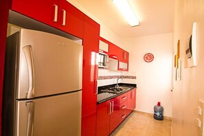 Comfort Apartment | Private kitchen | Full-size fridge, microwave, stovetop, coffee/tea maker