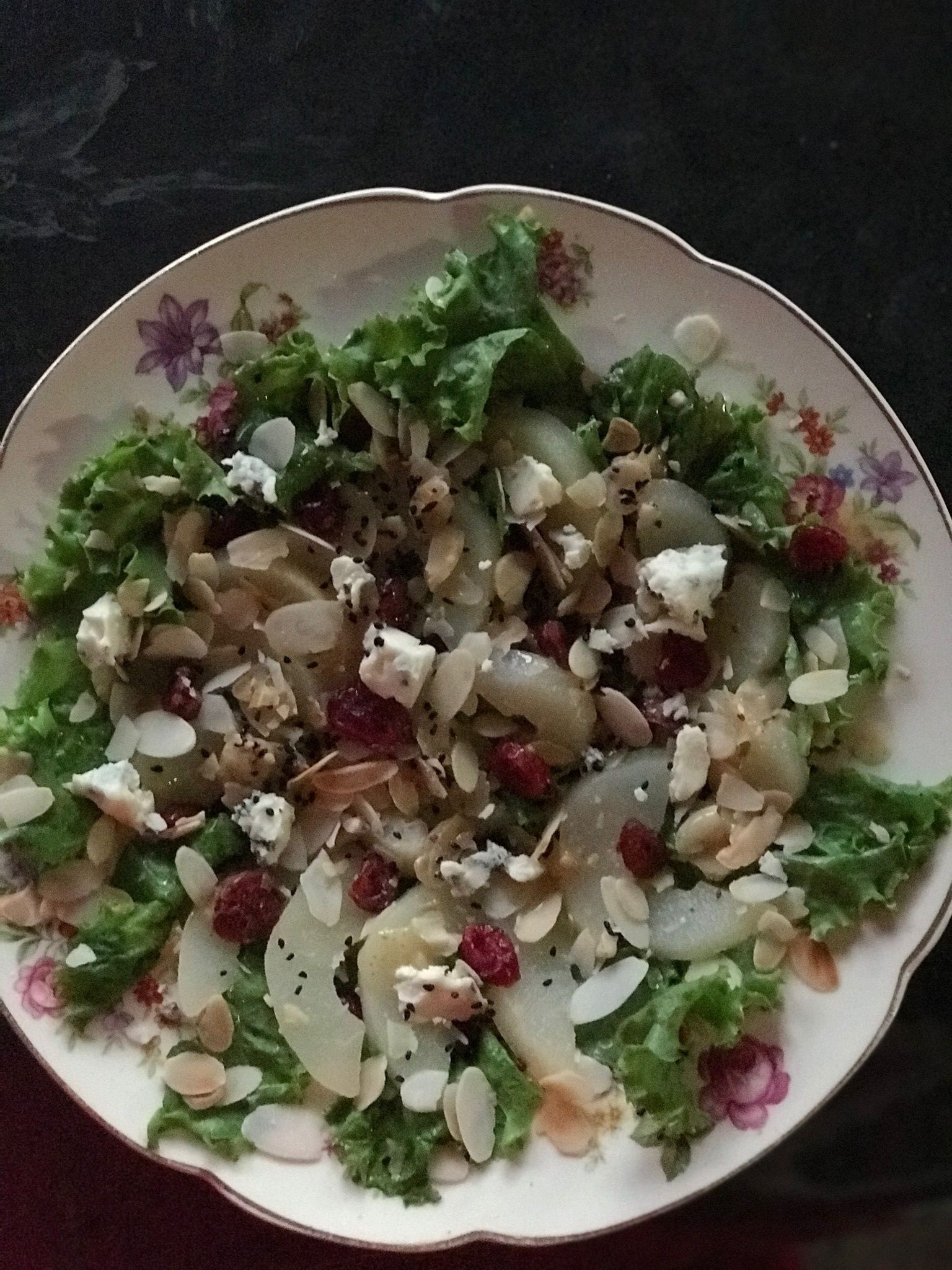 A bowl of salad with various ingredients.