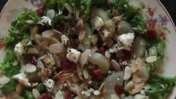 A bowl of salad with various ingredients.