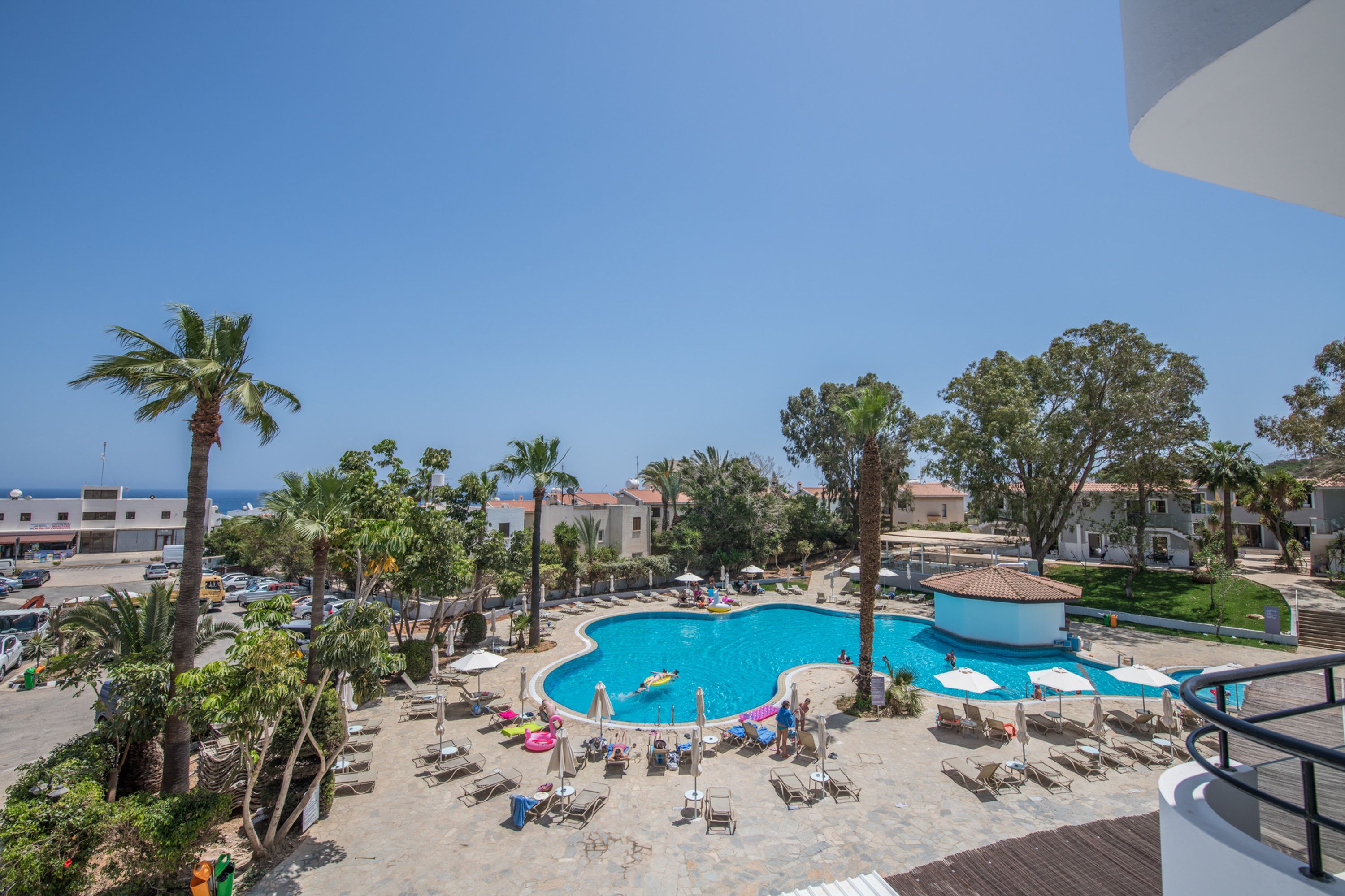 seasonal outdoor pool, pool umbrellas, pool loungers