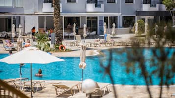 Seasonal outdoor pool, pool umbrellas, pool loungers