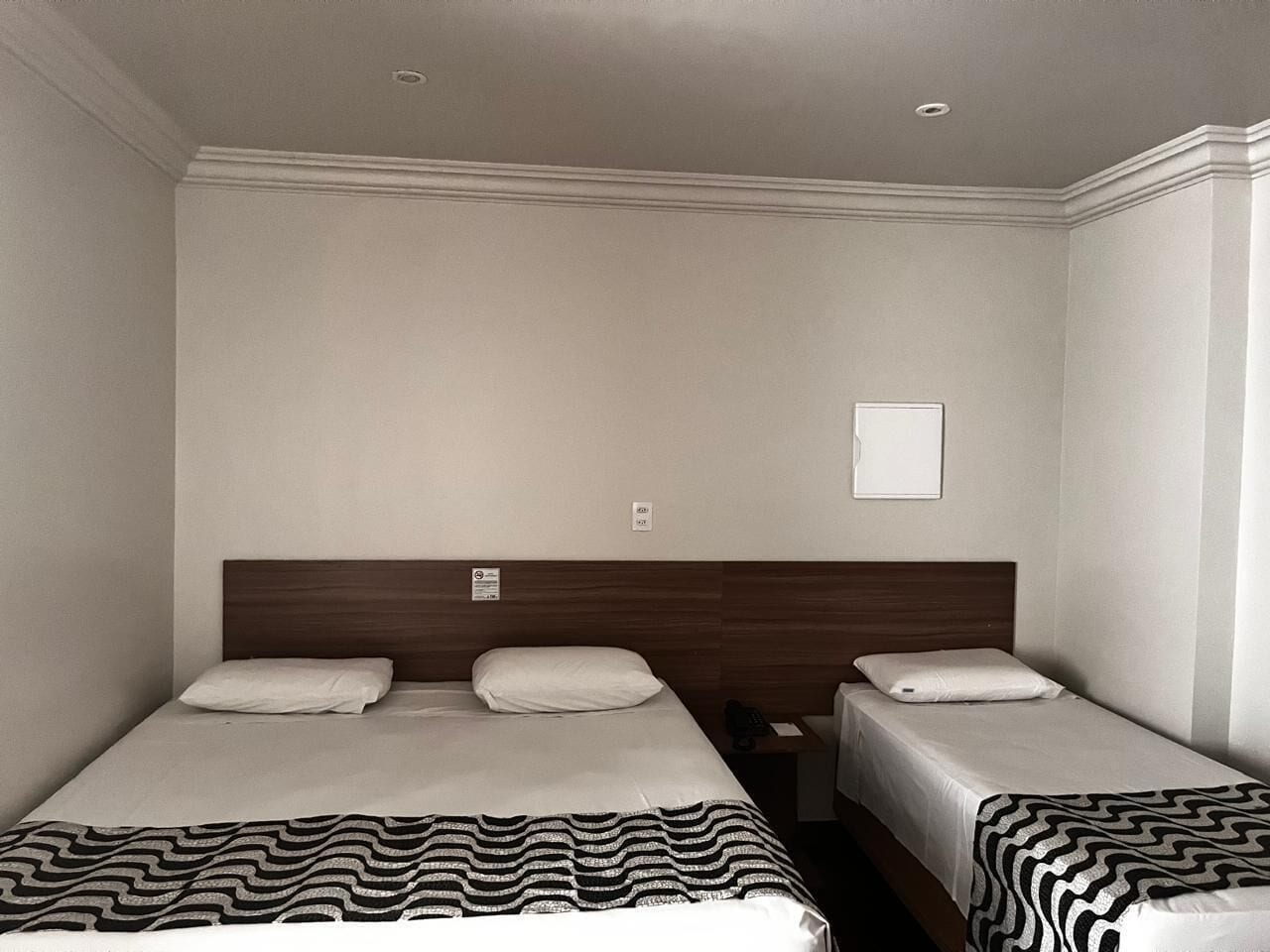 Economy Triple Room | Minibar, in-room safe, desk, laptop workspace