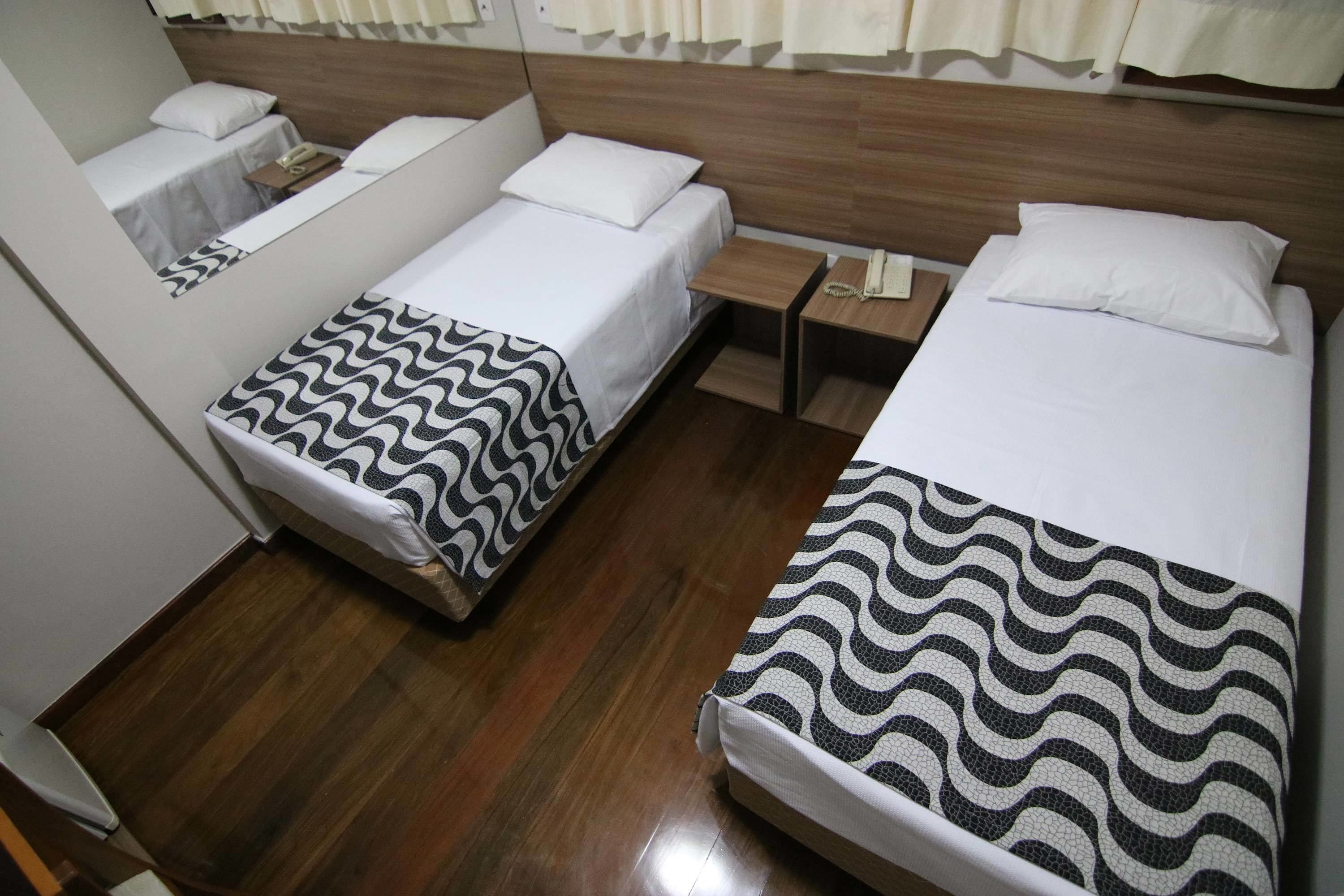 economy room, 2 single beds | minibar, in-room safe, desk, laptop workspace