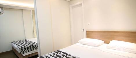 Superior Twin Room | Minibar, in-room safe, desk, laptop workspace