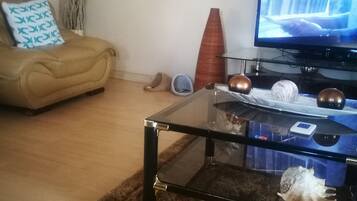 Royal House, Garden Area | Living area | Flat-screen TV