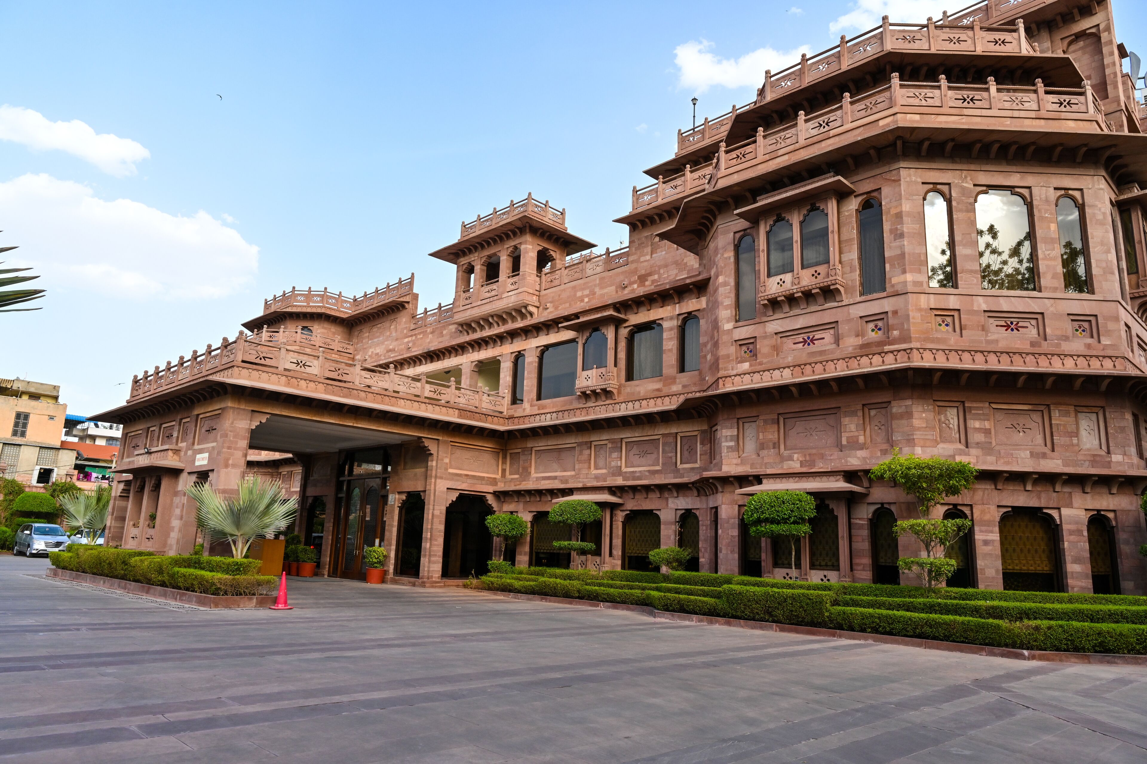 A large, historic building with multiple arches and a grand entrance.