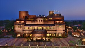 A large, multi-story building with a prominent tower and a sign reading "Radisson". - Radisson Hotel Jodhpur (Jodhpur)