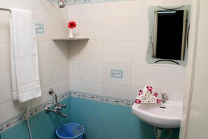 Shower, free toiletries, slippers, towels